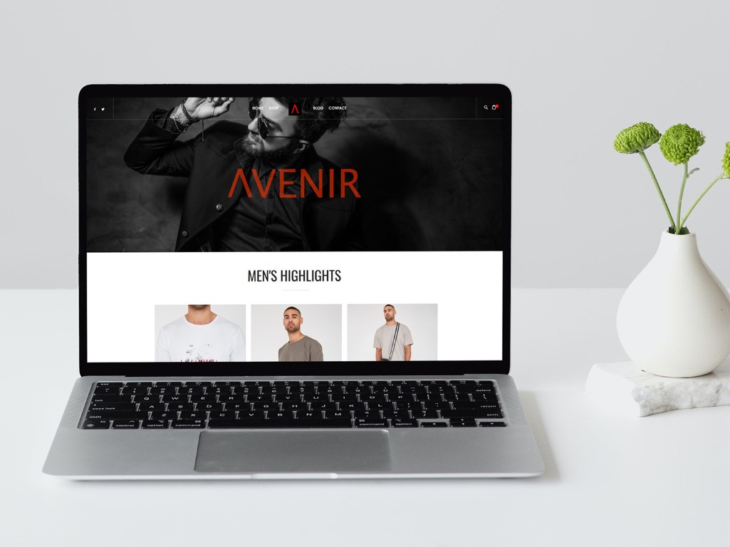 Avenir fashion website opened on a laptop in a white setting